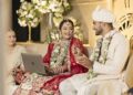Bride Works on Laptop at Wedding