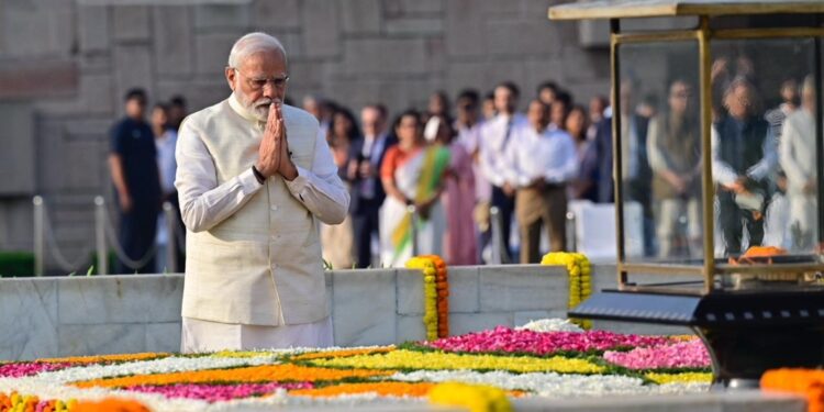 Prime Minister Narendra Modi paying tribute to Mahatma Gandhi at Raj Ghat