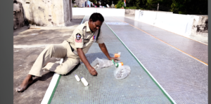 Tirupati head constable displaying national flag made with old coins
