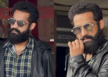 jr ntr new look grabs attention as the star is spotted at shamshabad airport amid dragon movie shooting updates.
