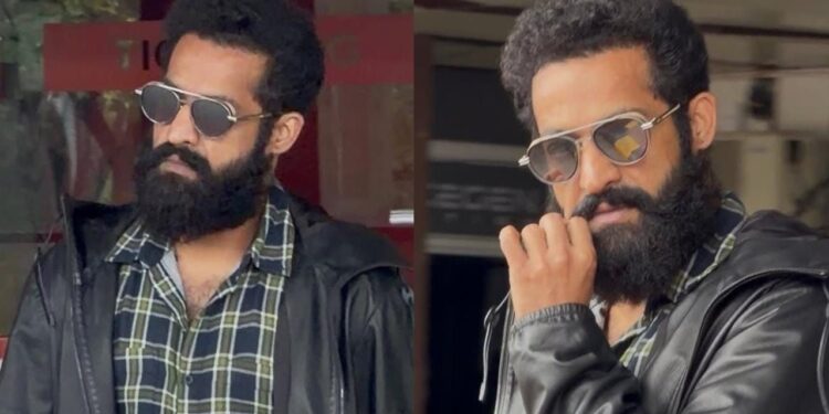 jr ntr new look grabs attention as the star is spotted at shamshabad airport amid dragon movie shooting updates.