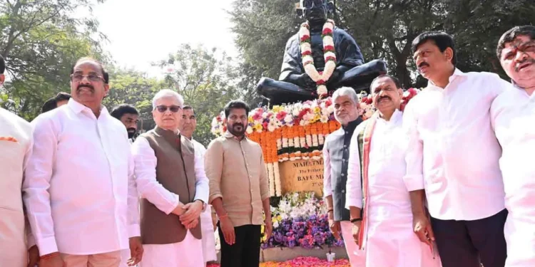 Telangana leaders offering floral tributes to Mahatma Gandhi at Bapu Ghat Hyderabad