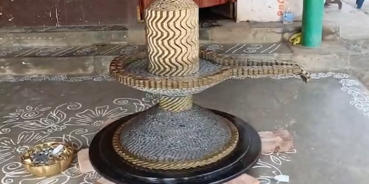 Dhana Shiva Lingam made with ten rupee coins by Sai Teja