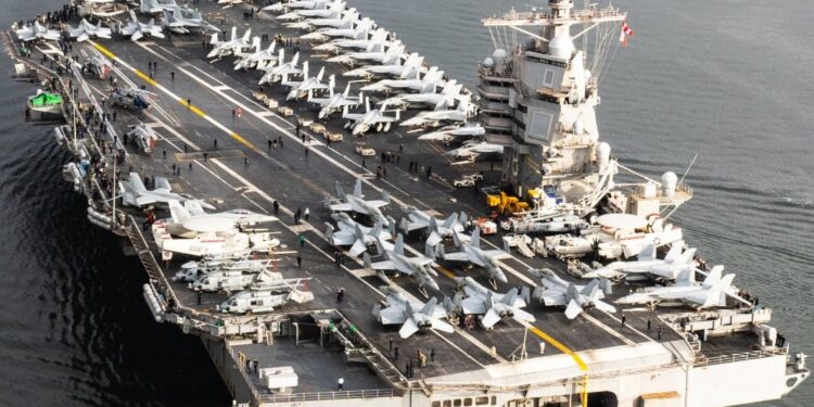 US deploys USS Gerald R. Ford to the Middle East, joining USS Abraham Lincoln amid rising Iran tensions and ongoing nuclear talks in Oman.