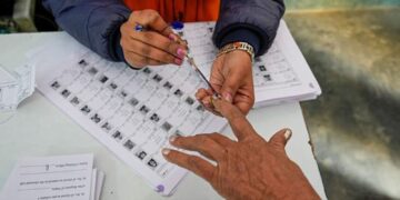 Voters casting ballots at municipal election polling station 2026